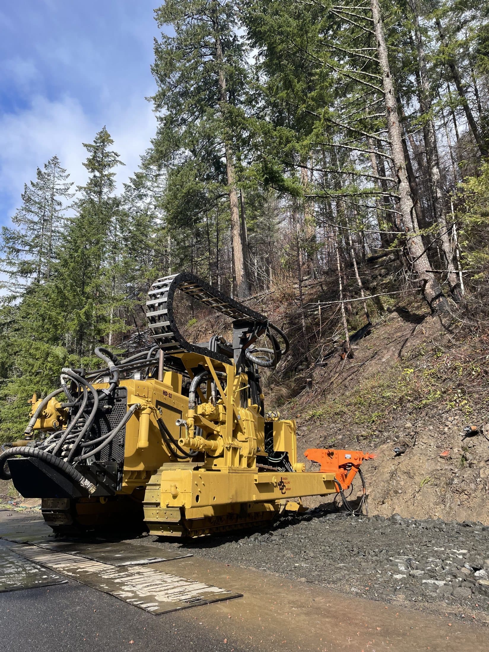 Horizontal drain outlet discharging groundwater into a forested streambed on US101